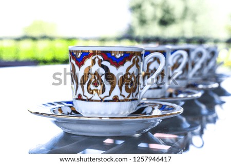 Traditional Turkish tea set in a  symmetric row. 