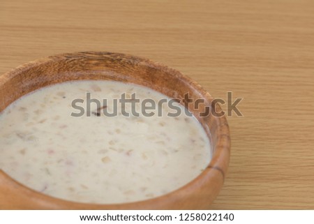 Clam chowder in a wooden dish
