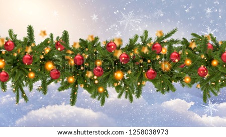 Christmas tree garland on a white snow background. Christmas balls on the garland. Winter Christmas background.