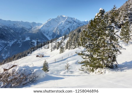 Winter Landscape with ski hut in the snow