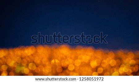 Abstract Yellow bokeh on blue background