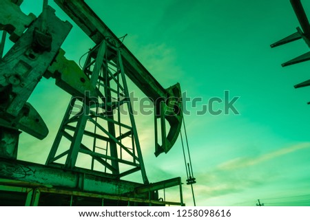 Oil pump.Oil pump jack. Extraction of oil. Petroleum concept.