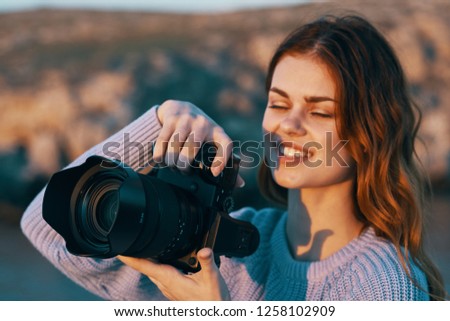 Woman with a camera in nature                      