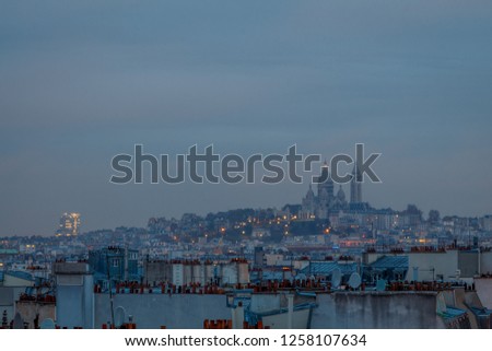 view of the Sacr?-Cour and the roofs of Paris at morning
