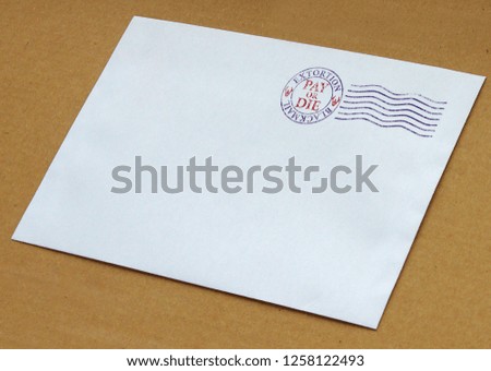 Envelope with postal stamp illustrating the concept of blackmail for extortion