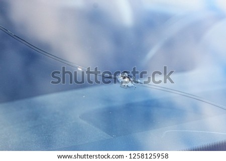 Glass damage from stone chips in the windscreen Royalty-Free Stock Photo #1258125958
