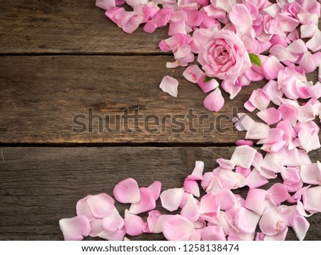 Romantic floral frame background/ Valentines day background, Pink roses on old wooden background. Top view, copy space