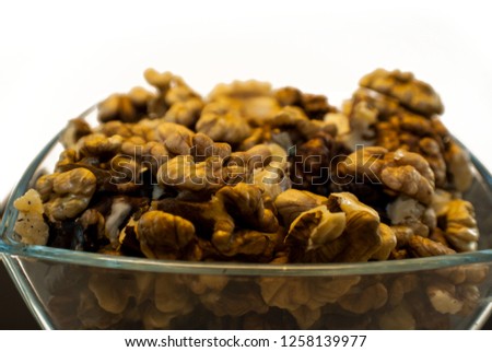 Pile of Cleaned Up Edible Walnuts Glass Fruit Bowl Close Up Food Photography