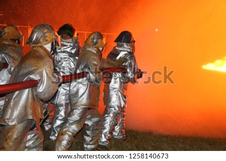 Fireman firefighting are included that are burning boldly not afraid to operate them.
