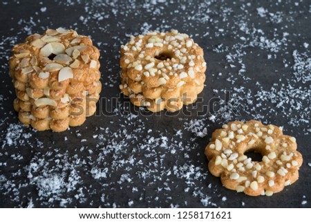 Christmas cookie with sugar sprinkles, against grey background