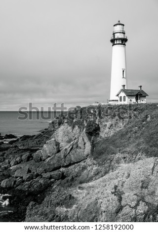 Northern California Pigeon Point Lighthouse and seascape natural pacific coast line with historic landmark Lighthouse black and white , monochrome , navigation protection naval travel by sea