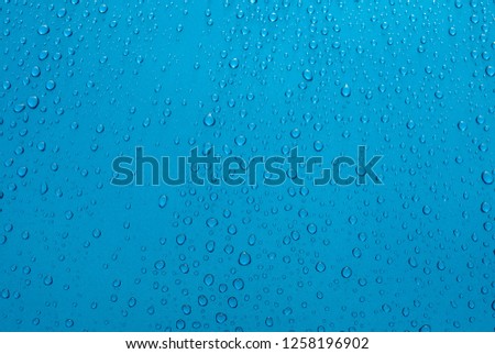 bodywork of car covered by water drops after storm, cleaned with wax, polished, weather, background, Italy