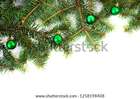Background for a Christmas card. Christmas decorations and spruce branches. Isolated on white background.