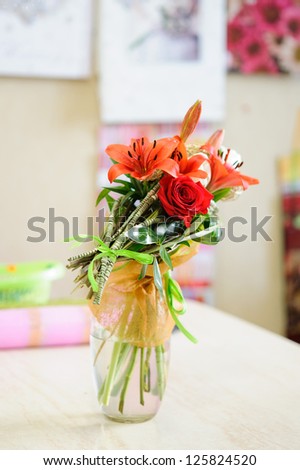 bouquet of flowers in a glass on the table