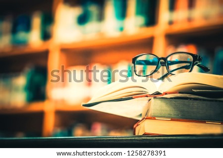 Glasses placed on the open book