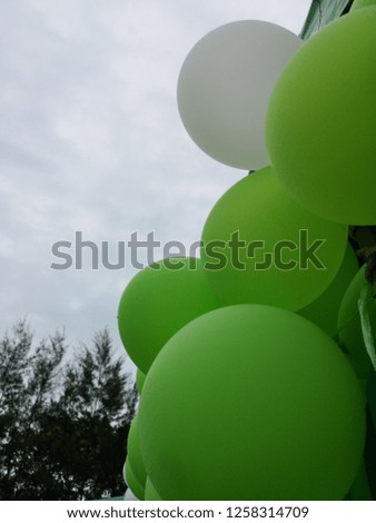 Green balloons with white
