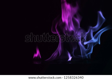Abstract colorful smoke on black background, fire design - photo image