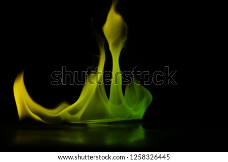 Abstract colorful smoke on black background, fire design - photo image