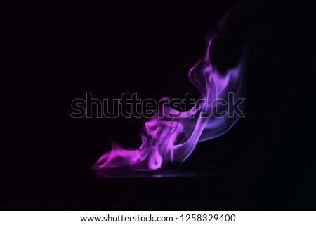 ฺBeautiful Abstract colorful smoke on black background, fire design - photo image