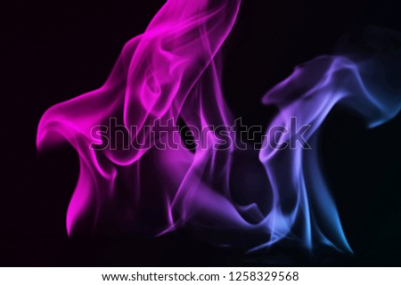 ฺBeautiful Abstract colorful smoke on black background, fire design - photo image