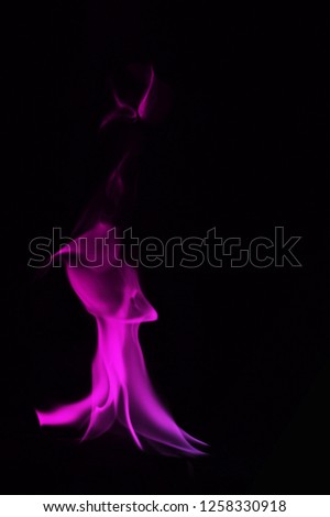 Beautiful  smoke on Colorful black background, fire design - photo image