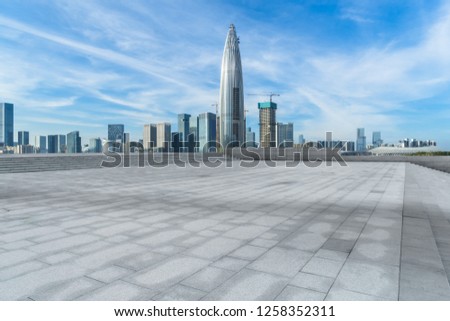 Panoramic skyline and buildings with empty square floor

