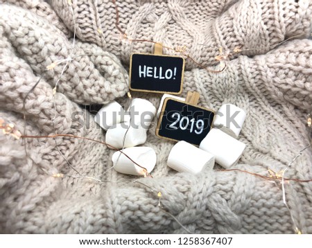 cozy hello 2019 background with chalkboards and marshmallows