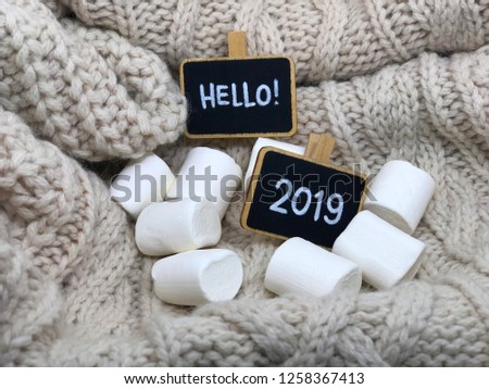 cozy hello 2019 background with chalkboards and marshmallows