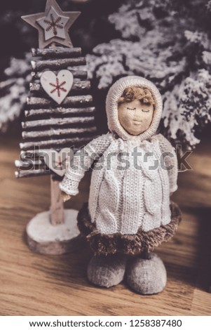 New Year or Christmas kids toy, wollen woman with wooden tree