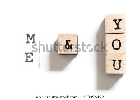 Timber wood stamp letters spelling out Me and You romantic message for a special loved lone