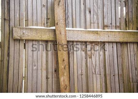 Fragment of an old brown-green wooden fence .  Wooden texture. Texture, background.Old wood painted surface