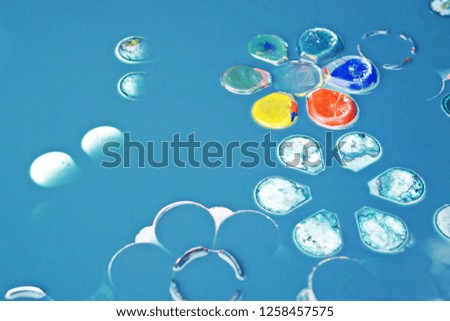 Color palette white plastic plates in blue water for cleaning