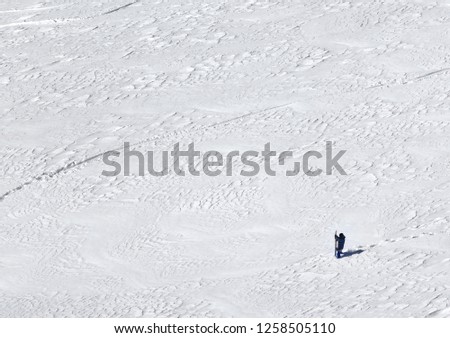 Snowboarder on snowy slope for freeriding at cold winter day. Caucasus Mountains, Georgia, region Gudauri. View from above.