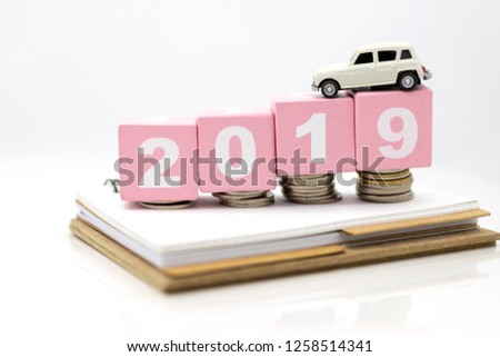 Miniature people : Car on wooden ping block 2019. Image use for Advertising product in the market today, competition on the business trading.