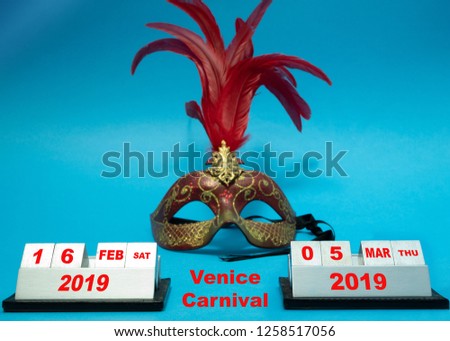dates of Venice Carnival in Italy at 2019 year. period, start and end day of festival with face mask on blue background