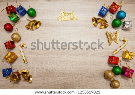 Christmas composition. Frame made of christmas decoration, christmas composition free space for add wording, balls, cones, golden star and fir tree. Flat lay, top view