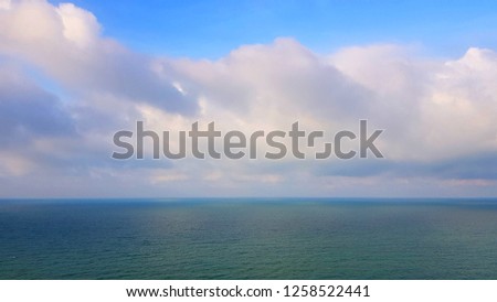 Beautiful blue sea water, blue sky and white clouds