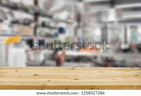 Blurred background of white kitchen furniture and kitchen desk top. Free space for your decoration