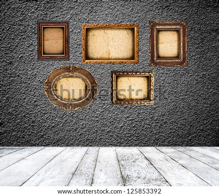 Empty room with blank vintage picture frames