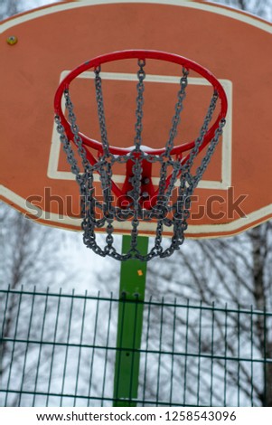 Outdoor sports basketball basket covered with snow