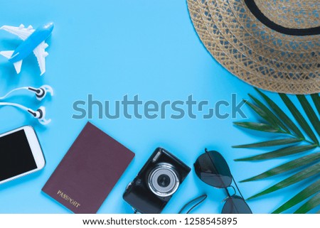 Top view, flat lay object accessories of travel or summer vacation concept with blank space on blue background.