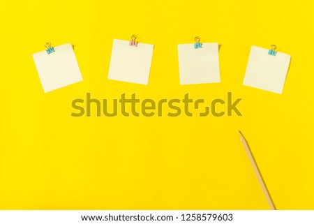 flat lay stationary on yellow background with copy space, office and education concept
