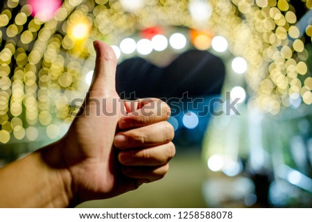 Hands and colorful lights On New Year's Day, Bokeh circle lights, background image with copy space.