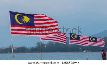 Malaysia Flag waving in the air with clear blue sky