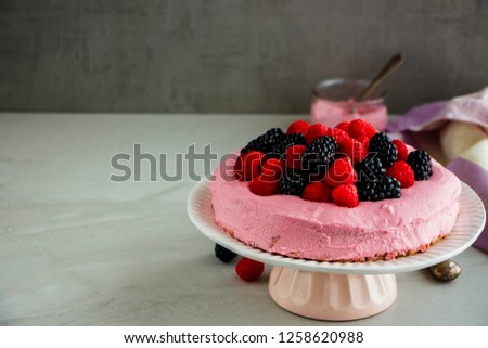 Delicious pink cake with mascarpone cream and fresh berries