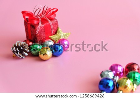 Red gift box on pink background.
