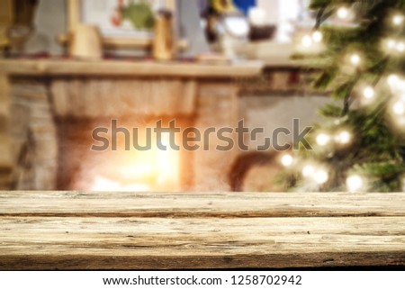 Table background of free space and christmas fireplace 