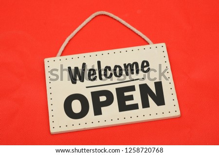 Welcome open sing sign on red background