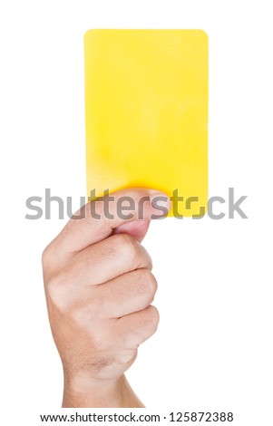 hand Of Soccer Referee Showing Yellow Card On White Background