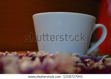 Coffee cup and flowers
